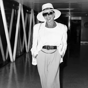 Joan Collins the english actress at Heathrow airport in August 1988