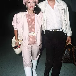 Joan Collins and Peter Holm at London Airport on the way to Nice September