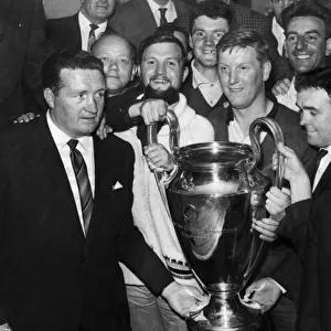Jock Stein proudly shows off the European Cup to Scottish referees at the Middleton