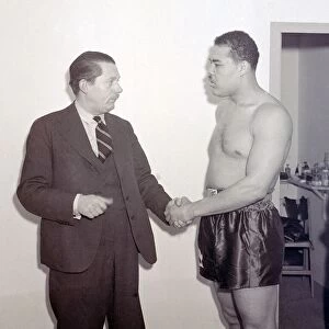 Joe Louis with Peter Wilson SP at Earls Court Boxer boxing