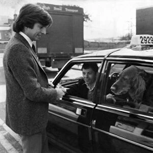 John Carter-Griffiths pays the cabbie Nigel Balcombe for Sammy the Setter