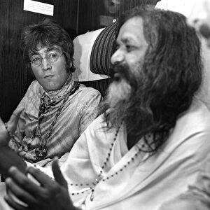 John Lennon and Mahirishi Yogi on the train going to Bangor, North Wales. 25 August 1967