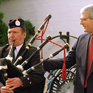 John Major with piper Billy Marshall while electioneering in Gretna Green April 1997