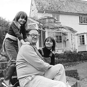 John Mortimer QC with his wife Penny and seven year old daughter Emily at their home in