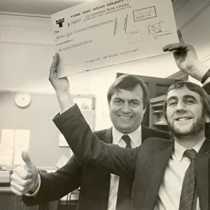 John Prescott hands over a cheques from Tyne Wear County Council to Norman Watson of