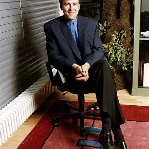 Jonathan Ross TV Presenter sitting in chair