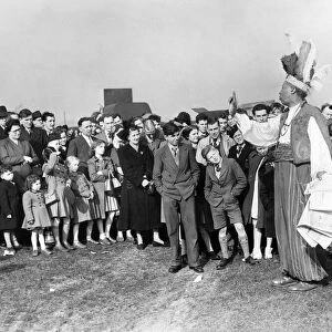Jump Sunday, Aintree. Colourfull tipster Prince Monolou charms a crowd of spectators who
