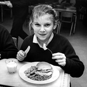 Kerry Dobison, 12, gets her dinner at Heaton Manor School