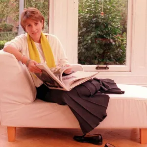 Kirsty Wark October 1999 TV Presenter reading a book on a sofa in her home