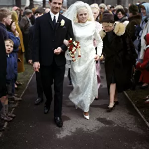 Leeds United footballer Paul Reaney with bride Sandra Proctor after their wedding