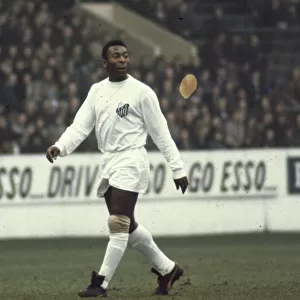 Legendary Brazilian footballer Pele in action for club side Santos during the match