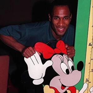 Les Ferdinand Football with cardboard cut out of Minnie Mouse cartoon character