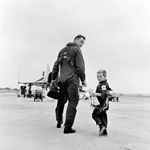Lieutenant Commander Peter Marshall of the Fleet Air arm with his four year old son