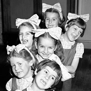 Six little dancing girls smile to camera and reveal that they have all lost their front
