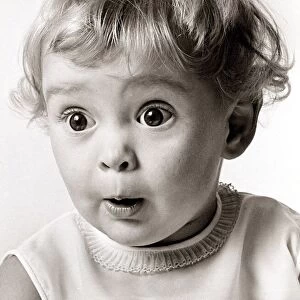 Little girl with a very surprised face expression, circa 1970