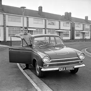 Liverpool footballer Ian St. John with his new Ford Cortina in Liverpool