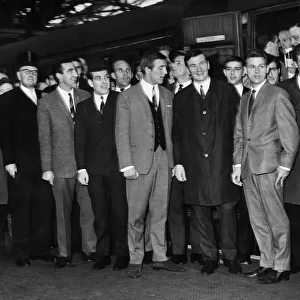 Liverpool footballers pose together at Lime Street Railway station before making he