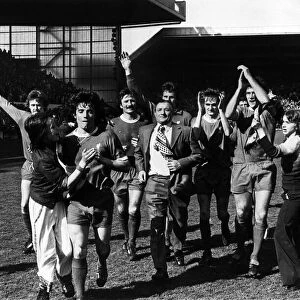 Liverpool manager Bob Paisley leads his team on a lap of honour to salute the Kop