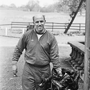 Liverpool trainer Ronnie Moran holding a large collection of player