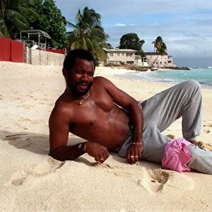 Malcolm Marshall West Indies cricketer relaxes on a sandy beach in Barbados 5th February