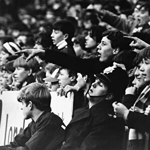 Manchester United fans fail to win the support of a policeman in 1966