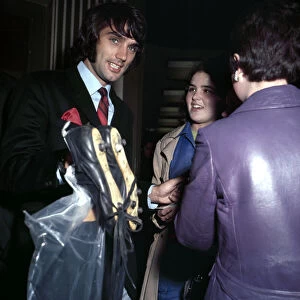Manchester United footballer George Best carrying his boots September 1969