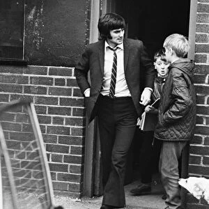 Manchester United footballer George Best leaving Old Trafford after receiving treatment