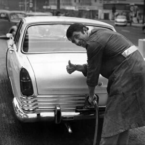 Manchester Uniteds David Herd, pictured filling up a car at his garage in Urmston