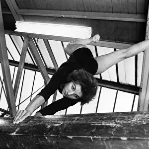 Margaret Bell does the stag stand on the beam. September 1968 P011461