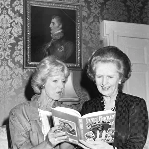 Margaret Thatcher and Janet Brown at 10 Downing Street reading Janet Brown