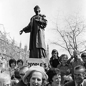 Margaret Thatcher in Pankhurst Gardens outside the Houses of Parliament standing under