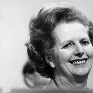 Margaret Thatcher smiling on podium at Tory party conference - October 1982