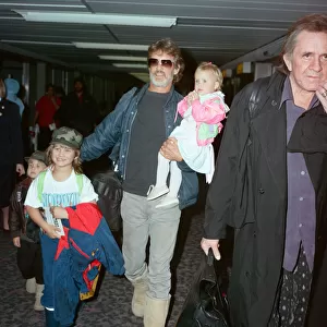 Members of The Highwaymen at Heathrow Airport. Kris Kristofferson