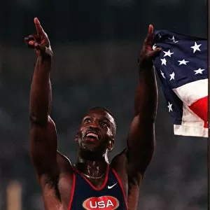 Michael Johnson celebrates his win in the 200 metres and the new World record at