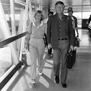 Michael Parkinson arrives at Heathrow with his wife Mary