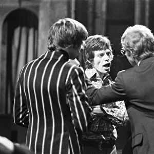 Mick Jagger talking to The Rolling Stones manager Andrew Loog Oldham (right
