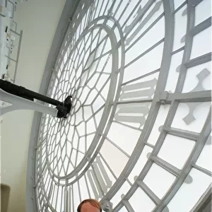 Mike McCann Keeper of the Great Clock December 1999, standing behind the face of
