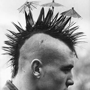 Mike the spike Lang with his Mohican haircut complete with tiny cocktail umbrellas