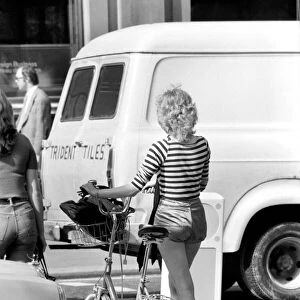 Model with a bicycle in Kings Road Chelsea, London. April 1975 75-2156-009