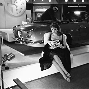 Model sits beside a Sprint CTC at the British International Motor Show in London 19th