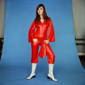 A model wearing a scarlet catsuit in gleaming cire by House of Ailish, £9