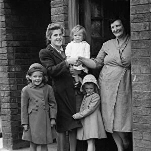 Mrs Davies welcomes Mrs Thompson and her children, to her home in Stonefield Road Huyton