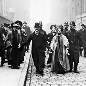 Mrs Emmeline Pankhurst Under Arrest. 21st May 1908. being escorted by Policemen