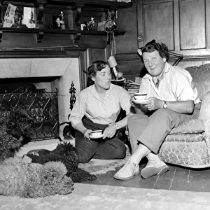 Mrs. Moss seen here with her dogs. 1954 A145b-003