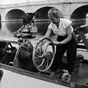 Mrs Tepper on her boat Cornelia with her cat Sinbad, at Kingston Bridge, London