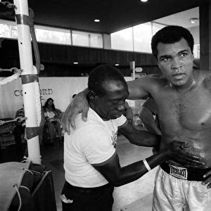 Muhammad Ali Heavyweight Boxer, Mar 1976 getting a rub down from his masseur