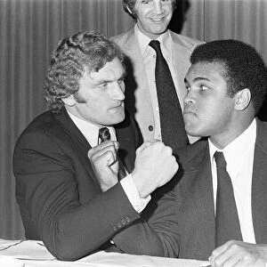 Muhammad Ali and Joe Bugner at a press conference for their upcoming fight
