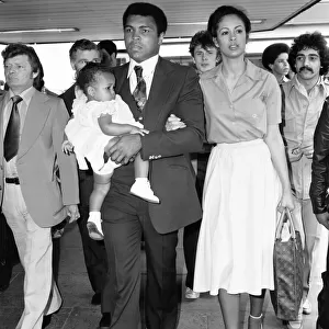 Muhammad Ali with second wife Veronica and their baby girl Hana arriving in England