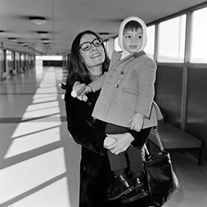 Nana Mouskouri arrives at Heathrow Airport from paris, with her son Nicky, aged 2