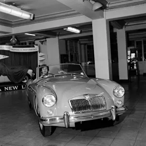 A new MG car on display in a showroom. 22nd September 1955